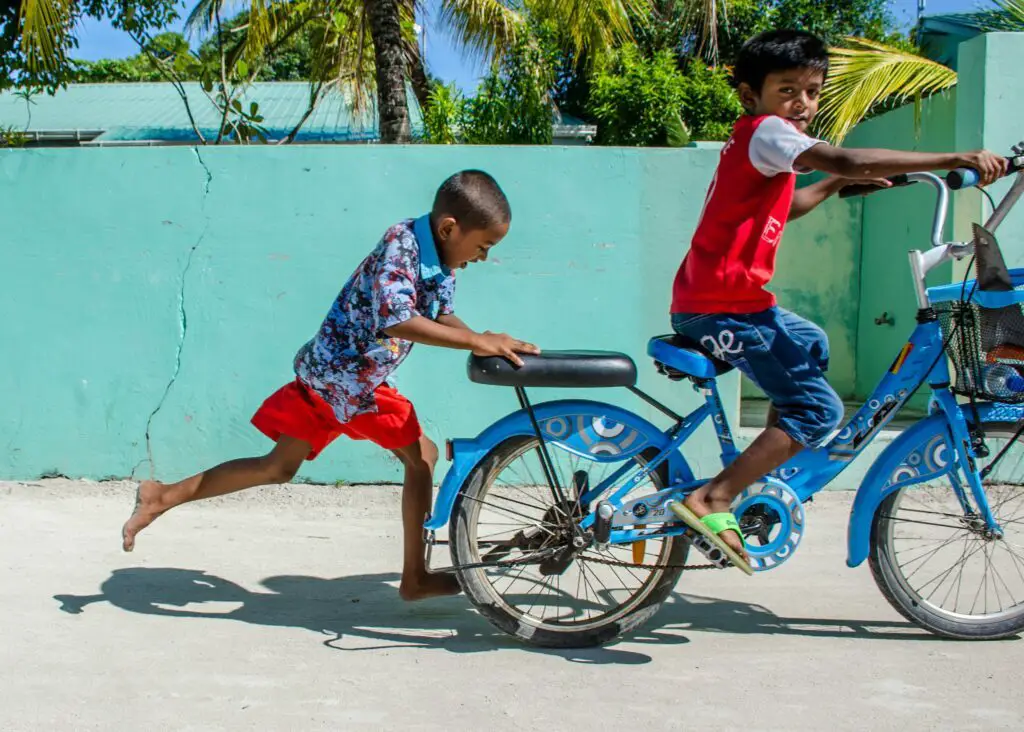 Kids playing on the streets of a village in the Maldives - Photo by Supriya S at Unsplash