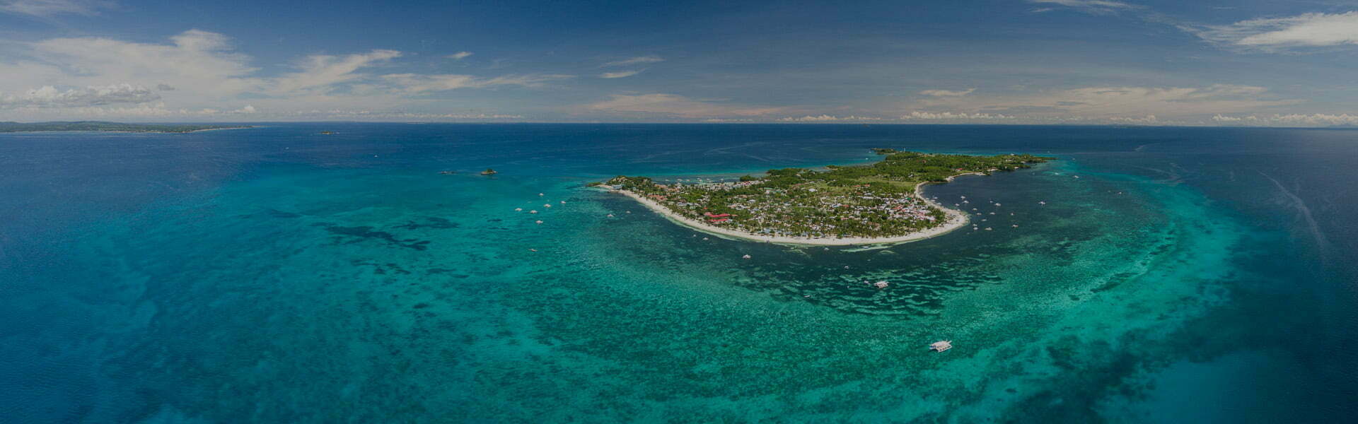 Aerial view of Malapascua. The island is known for Thresher Sharks and white sand beaches - Photo by Discover Malapascua